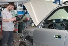 Technician performing collision repair at D & S Body Shop